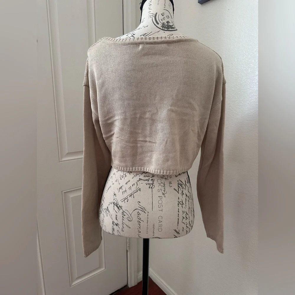 The LA cream and ur luv seoul ripped knitted crop top